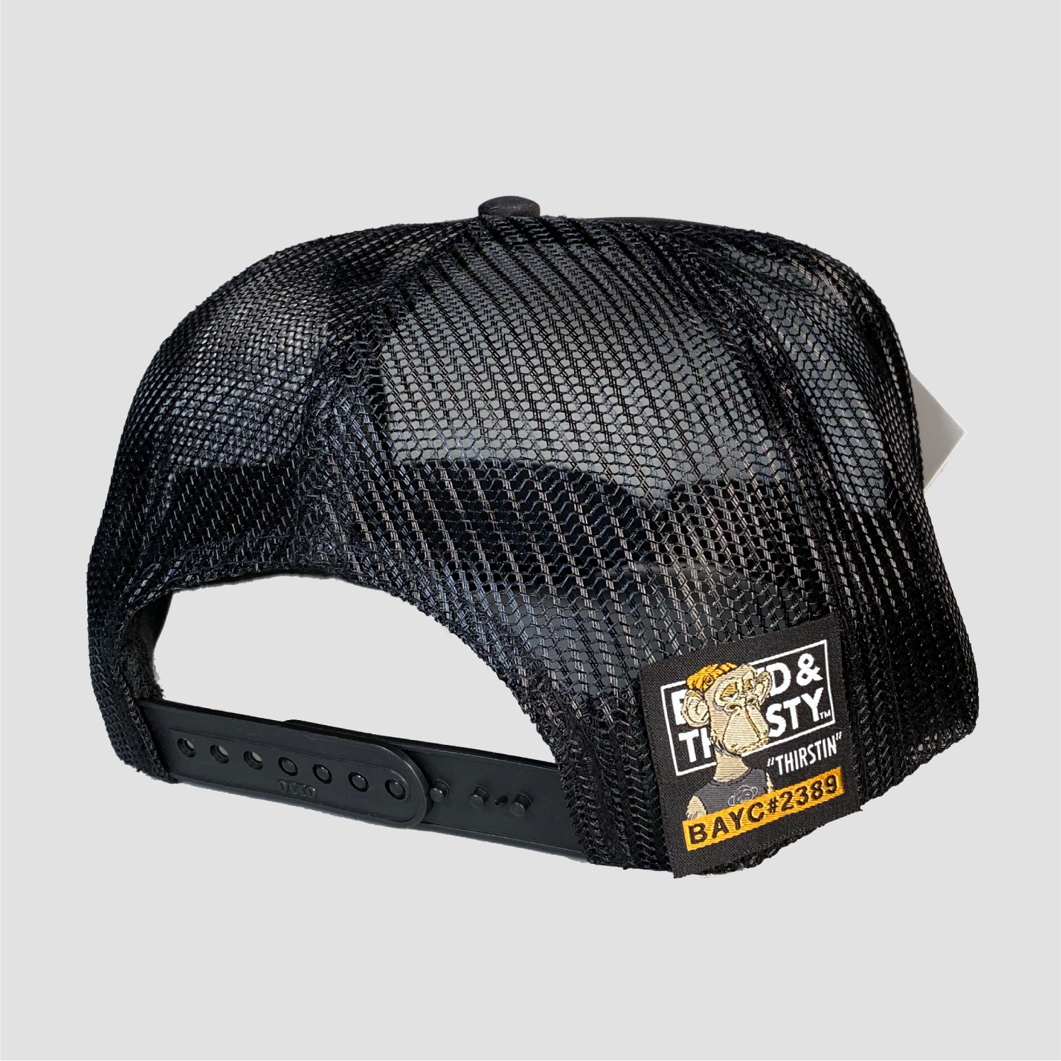 No detail or expense spared with our classic black trucker cap. Check out the sewn on label.